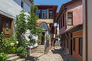 Fototapeta na wymiar Street and houses from the period of Bulgarian revival in old town of city of Plovdiv, Bulgaria
