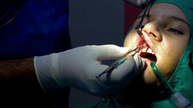 Oral dental surgery operation, tooth gum apicoectomy cyst removal