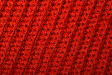Red knitted wool texture can use as background.