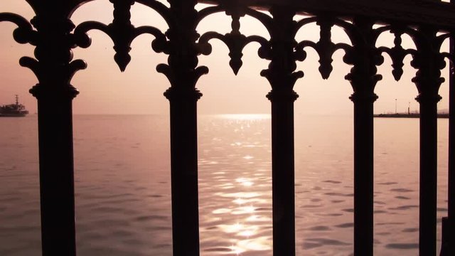 Pink sunset at the sea, view from the embankment