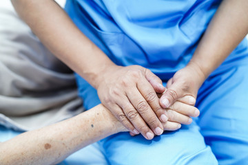 Holding Touching hands Asian senior or elderly old lady woman patient with love, care, helping,...