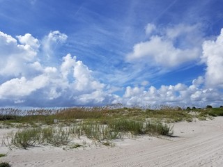 sandy beach with clouds