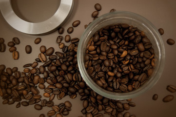 coffee canister lid and coffee beans scattered on the table