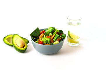Salmon Poke Salad with spinach and basil on white background. Homemade food. The concept of tasty and healthy meal. Copy space, close up.