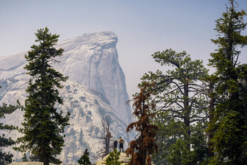 View towards Half Dome; smoke from Ferguson Fire present in the air; Yosemite National Park, California