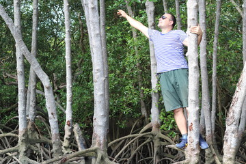 Naklejka na ściany i meble Man in the mangrove forest