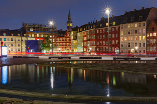 Bertel Thorvaldsen's Square, Copenhagen City Hall and colorful houses with their mirror reflection in reflecting pool at night, Copenhagen, capital of Denmark