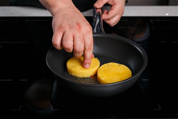Chef frying polenta