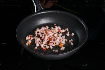 Bacon in a frying pan