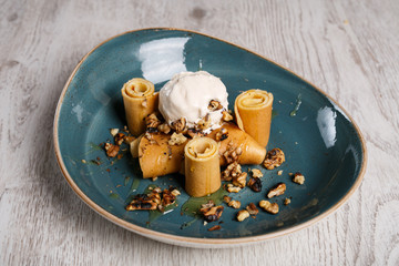 European pancakes, crepes, with honey and fried wallnuts