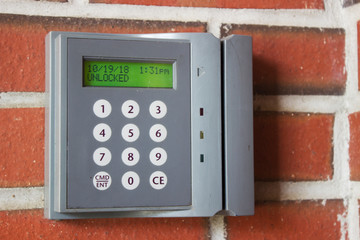 Unlocked card access machine on a brick wall
