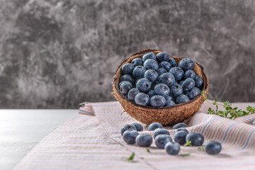 Fresh ripe wild blueberries in bowl. Wild blueberry in top view flat lay with copy space for background or wallpaper. Healthy and delicious fruits concept of blueberry.