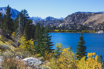 Beautiful vibrant panoramic view of June Lake, Mono County, California, with Mountains of Sierra Nevada and Carson Peak in the background, United States