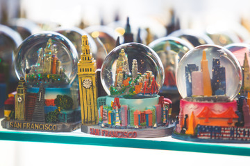 View of traditional souvenirs from San Francisco, with fridge magnet, crystal balls and cable car...