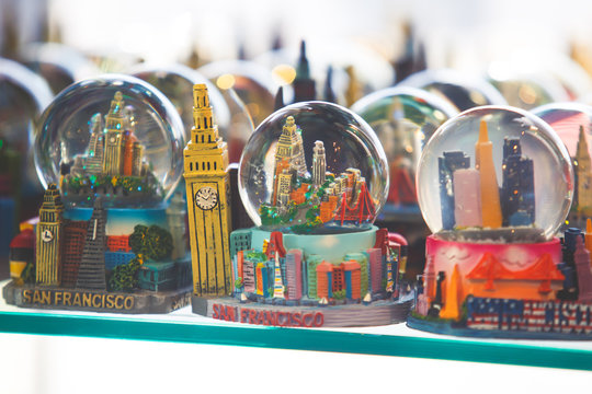 View of traditional souvenirs from San Francisco, with fridge magnet, crystal balls and cable car miniature models in souvenir shop of Fisherman's Wharf, California