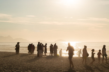 tourists enjoying sunrise on copacabana beach rio de janeiro brazil