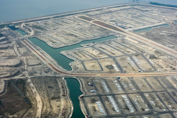 Aerial view of empty land lot at near Jakarta sea