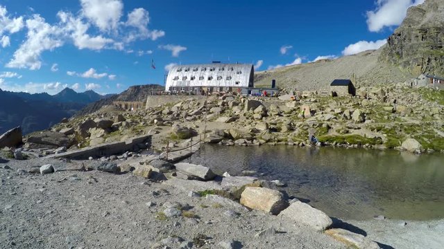 Panorama of mountain lake near Vittorio Emanuele II Refuge hut on expedition to Gran Paradiso summit on Italian Alps