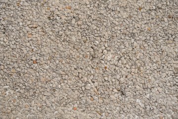 brown and white stone in cement on texture and background