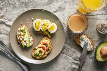 Overhead view of avocado toasts. Plant-based food