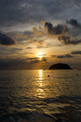 View of Koh Pu island at sunset from Kata Phuket beach, Thailand