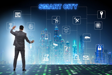 Concept of smart city with businessman pressing buttons