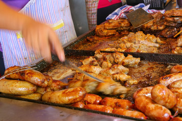 Meat is being cooked for asado at Mercado 4 in Asuncion, Paraguay