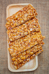 Peanut sesame snack, (Tua gra joak) sweet peanuts stick. © tachjang