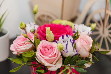 Beautiful bouquet of various flowers. Bright flowers in a bouquet. Roses as a gift.