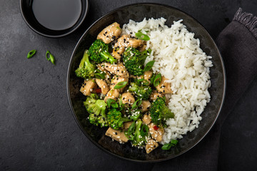 teriyaki chicken and broccoli with steamed rice in bowl - 234402222
