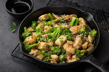 teriyaki chicken and broccoli in cast iron pan