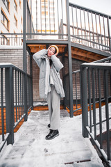 fashion outdoor photo of gorgeous sensual woman with black hair in elegant clothes  walking by winter city