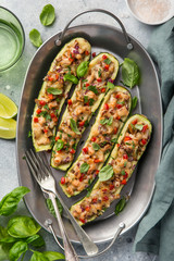 Stuffed zucchini boats with vegetables and cheese