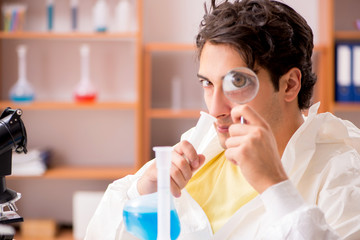 Young biochemist working in the lab 