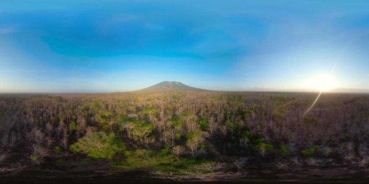 vr360 low growing tropical forest at foot mountain at sunset. aerial view mountains, tropical landscape, Indonesia. Aerial footage.