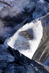 Large chunks of black obsidian glass exposed