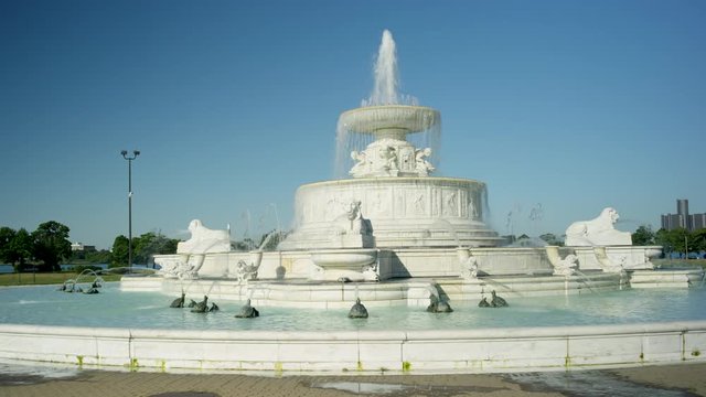 Medium Panning Shot Of Belle Isle Fountain With Detroit In Background