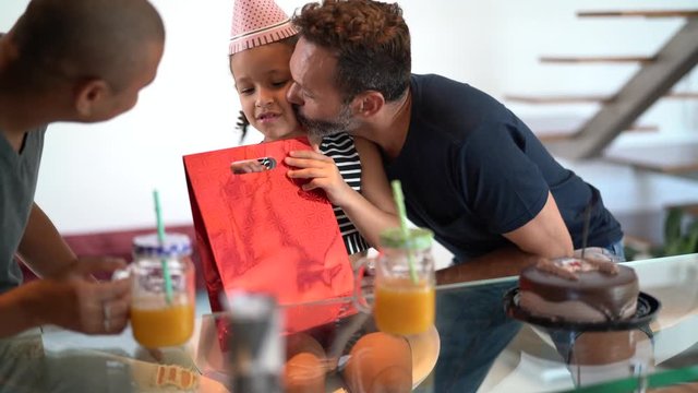 Modern Family - Gay Couple with Adopted Children - giving present to birthday party