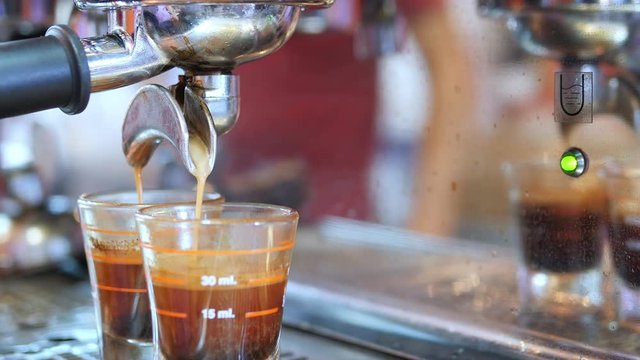 Closeup of tea maker machine during making shots in coffee shop