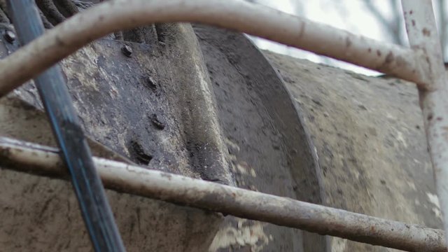 Close-up of rotating tank car mixers include connecting fresh cement mixture