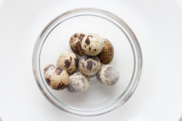 quail eggs in a glass bowl