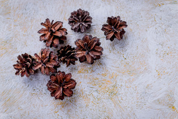 Florist decorator making Christmas wreath handmade on a white table. Women's hobby. Preparations for the holidays concept.DIY Christmas wreath with pinecones.resh and all natural materials.copy space