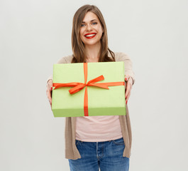 Fototapeta premium Happy woman holding green gift box.