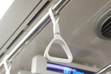 hand grip of passenger within the sky train to travel