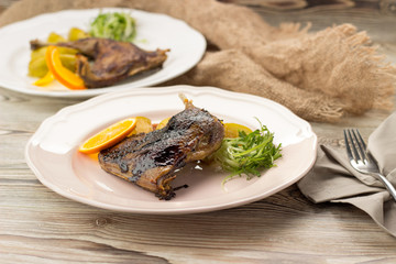 Duck leg confit with orange and herbs