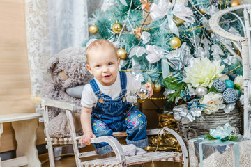 little girl near the Christmas tree