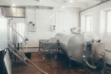 Production of milk and yogurt at the plant. Metal units and tanks for storage and transportation.