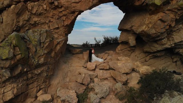 Couple Kissing on the Top of the Mountain Aerial Shot in Devil's Backbone