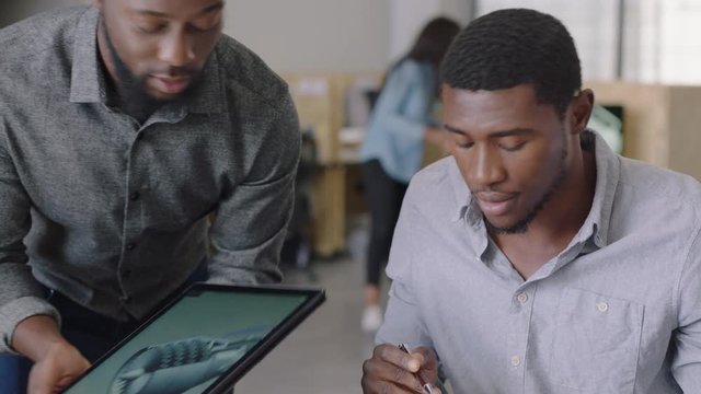 african american business people brainstorming engineers designing prototype engine turbine using tablet computer 3d technology creative team collaborating teamwork sharing ideas in office meeting