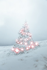 Magical Christmas tree with fairy tale light covered in deep snow. Winter holiday background
